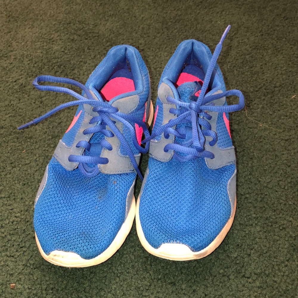 Blue and pink Nike tennis shoes